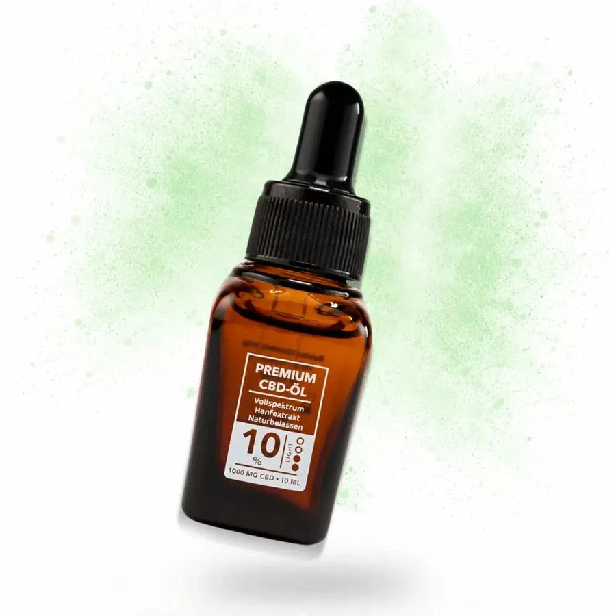 Pipettenflasche CBD Öl mit 10 Prozent vor grüner Pulverwolke, CBD Tropfen 10 Prozent